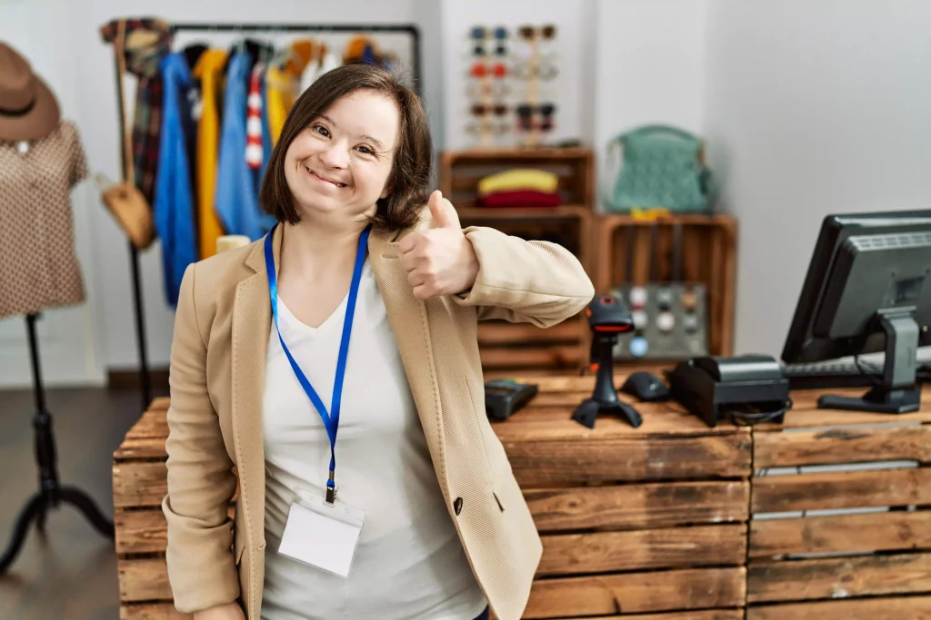 women with down syndrome disability dressed in formals doing a thumbs up
